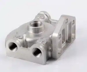 CNC machined aluminum part by ZhuanXin Precision with threaded holes and smooth finish for industrial use.