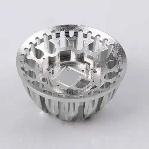 High-precision CNC machined aluminum heat sink by ZhuanXin Precision with intricate design for industrial use.